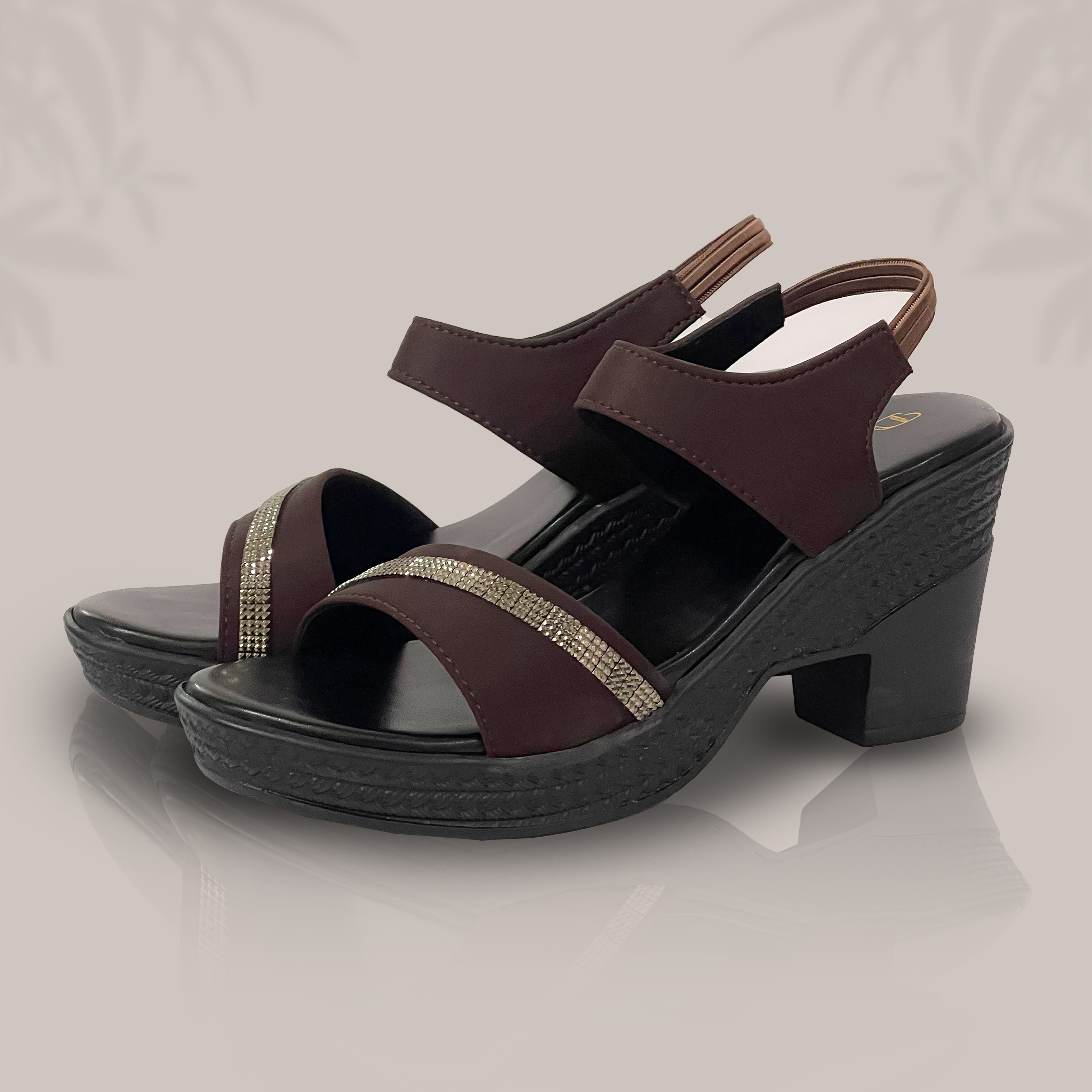 Pair of brown sandals with a block heel on a light gray background