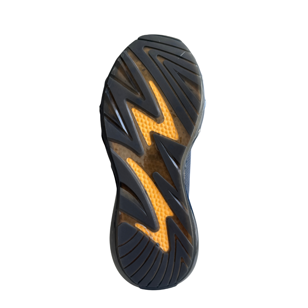 Close-up of a black and orange athletic shoe sole on a white background