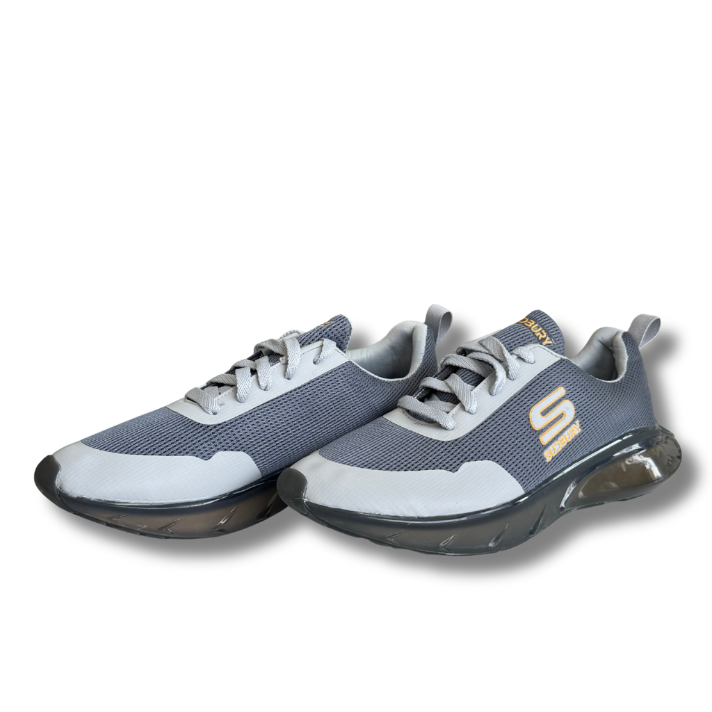Gray and white athletic shoes with a brand logo on a white background