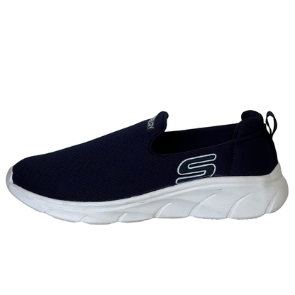 Black slip-on sneaker with white sole on a white background