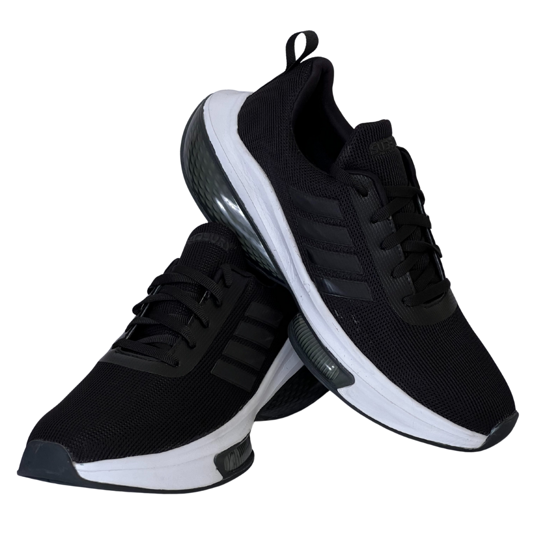 Black sneakers with white soles on a white background