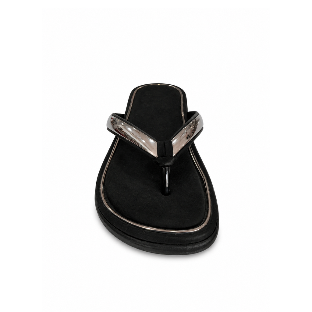 Black sandal with a metallic strap on a white background